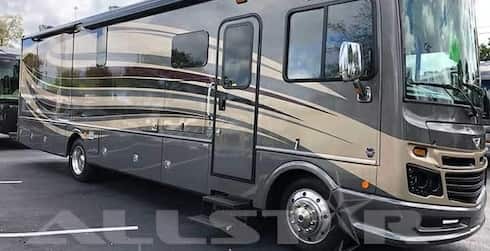 RV Rental: 36' Fleetwood Bounder Exterior entry view with slides retracted.