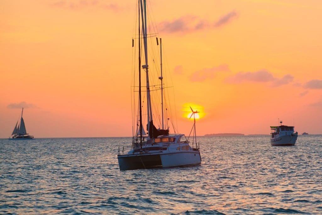 Boats on the water during sunset