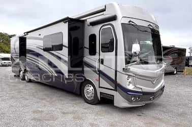 RV Rental: 44' Fleetwood Discovery Exterior view with slides extended