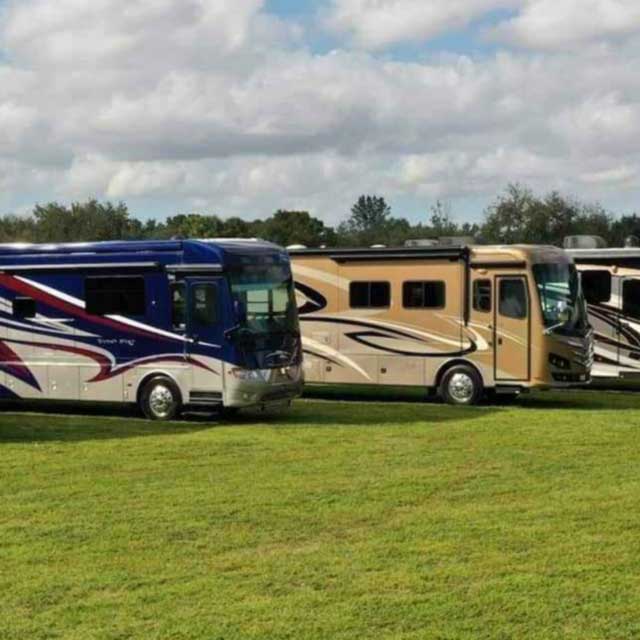 Allstar Coaches motorhomes parked in a field